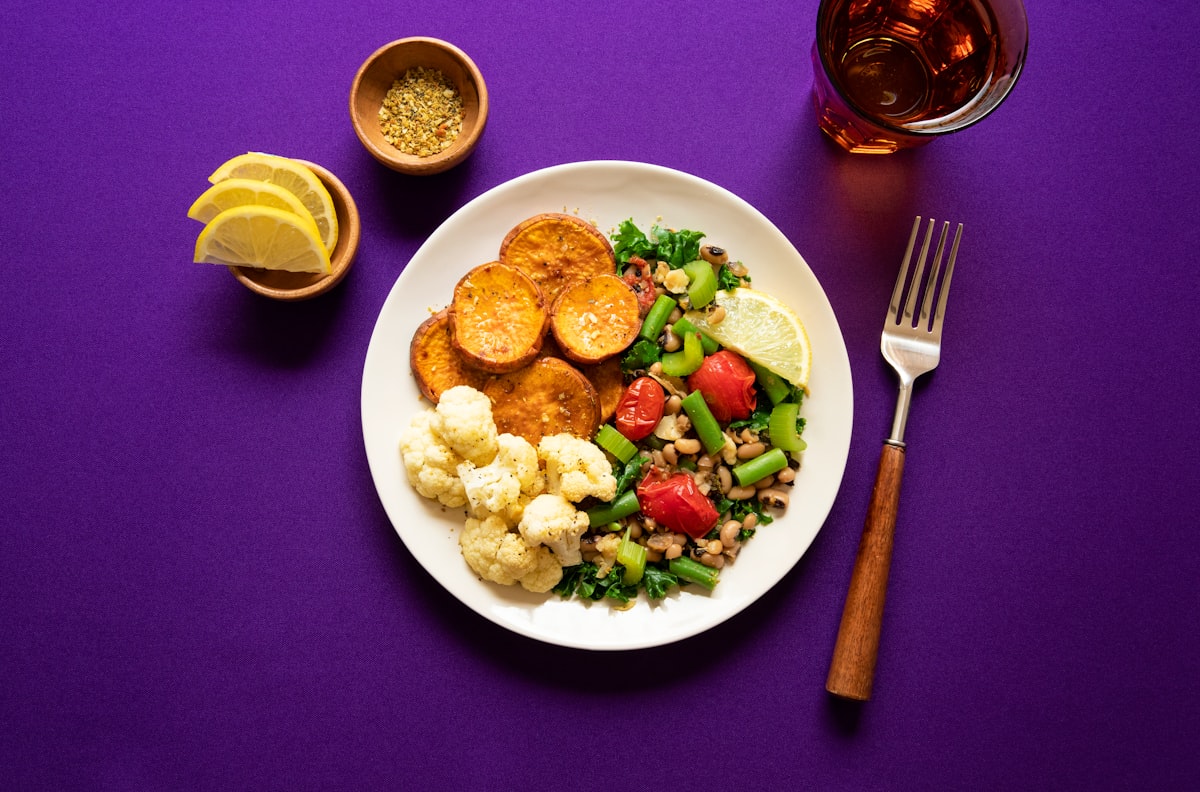 Colorful array of foods that stabilize blood sugar including vegetables, whole grains, nuts and berries